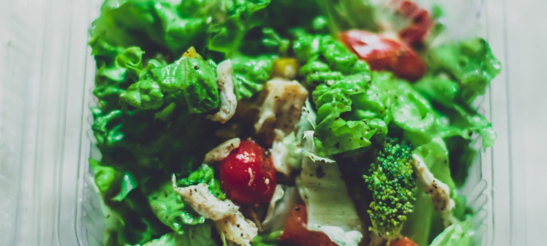 Fresh, colorful ingredients arranged in natural kitchen setting showcasing whole foods approach
